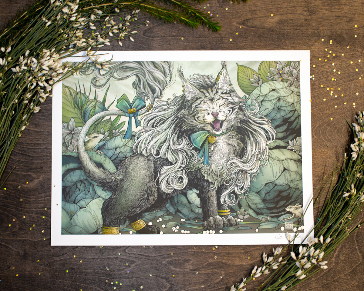 A photograph of a print sitting on a table. There are fresh flowers on the upper left corner and bottom right. There is also gold star confetti on the table. The illustration is of the original card art of Arahbo roar of the wild for Magic the Gathering. Araboh is show looking proud and fluffy. He has gold bangles and bows on his chest and tail. There is large foliage behind him and a small mouse. 
