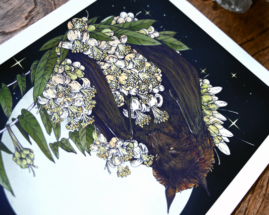 A cropped photo of the print. You can clearly see the bats face and flowers but the rest of the print is blurred.
